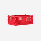 Red collapsible storage box for home organization by Flying Tiger Copenhagen, measuring 10x15 cm, shown folded and expanded.