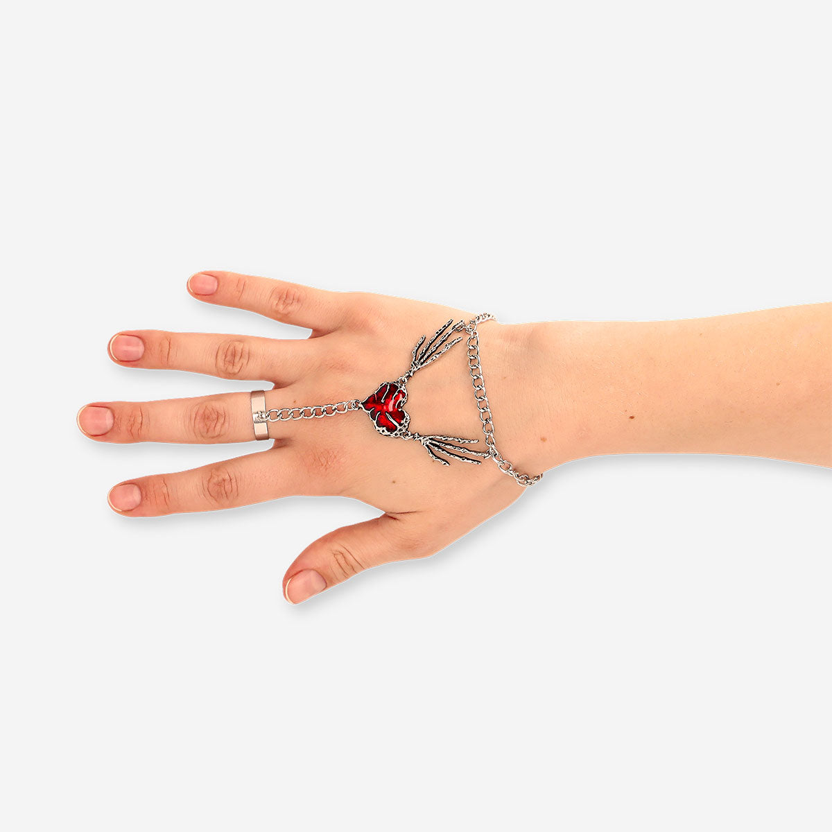 Silver textile jewelry with a red heart charm, featuring intricate hand-crafted design by Flying Tiger Copenhagen.