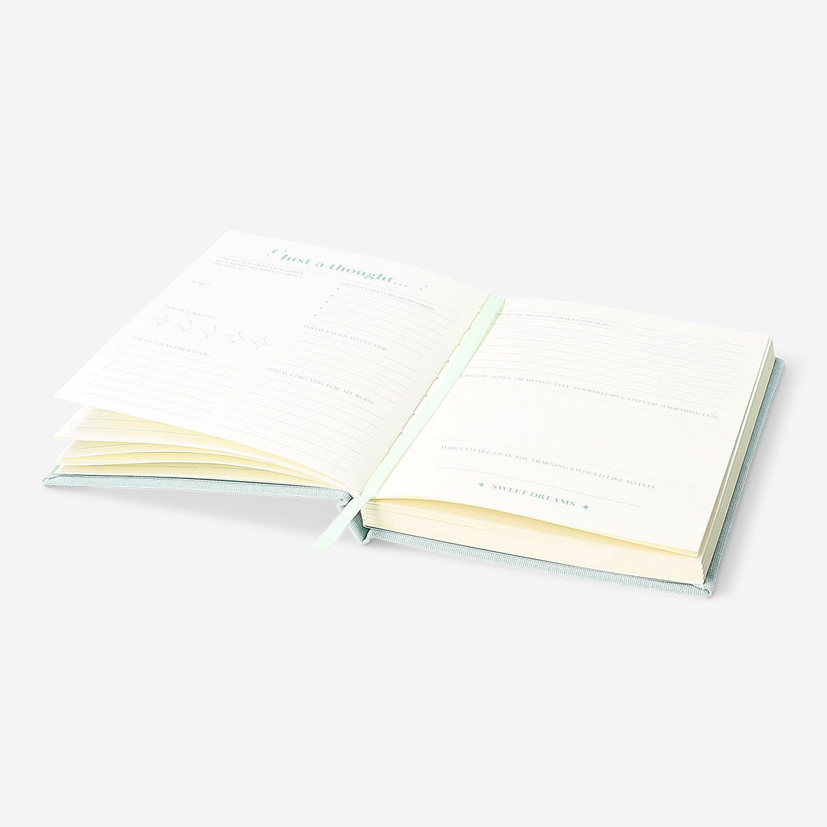 Flying Tiger Copenhagen Bedtime Journal in English, featuring a sleek office design with pages open for nighttime reflection.