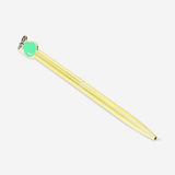Gold Flying Tiger Copenhagen office ballpoint pen with a green pear-shaped topper on a white background.