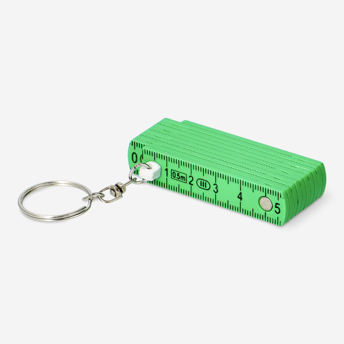 Mini folding green ruler key ring gadget from Flying Tiger Copenhagen with compact design and metal keyring attachment.
