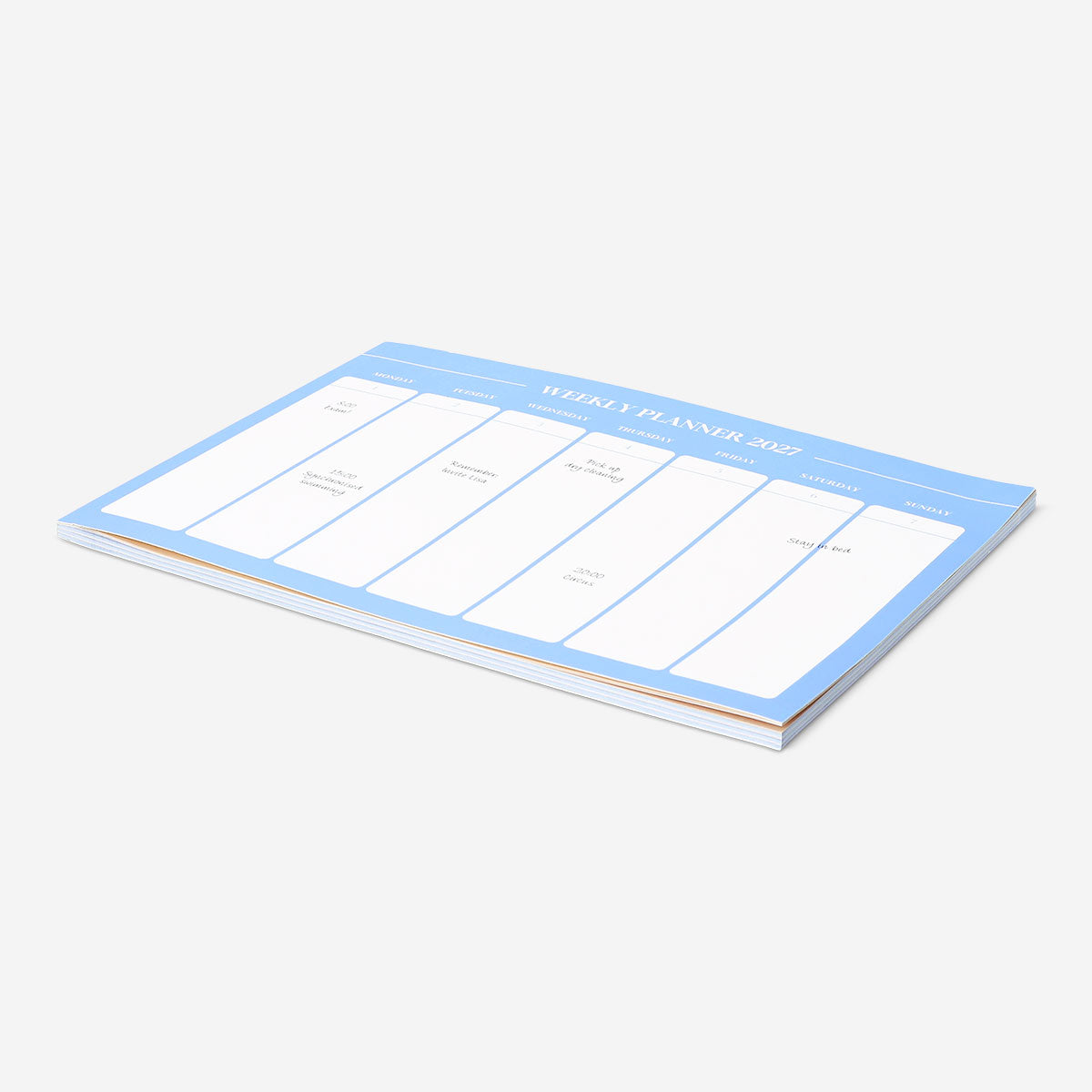 Blue A4 weekly planner from Flying Tiger Copenhagen, featuring pages for organizing weekly schedules in an office setting.