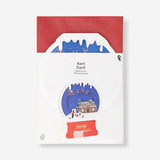 Flying Tiger Copenhagen Christmas card featuring a festive snow globe design for office holiday greetings.