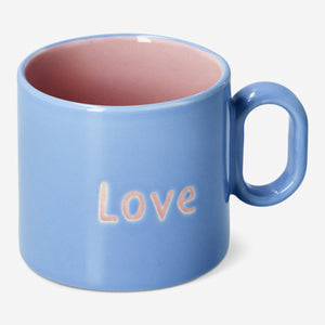 Blue designer kitchen mug with text, 313 ml capacity, by Flying Tiger Copenhagen, shown with a close-up of the mug's design.