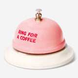Flying Tiger Copenhagen Bell Ring gadget for coffee, featuring a small, decorative metal bell with a colorful handle.