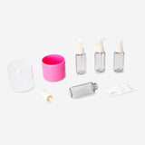 Pink travel set with stickers in a compact case, includes four leisure accessories by Flying Tiger Copenhagen.