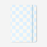 Blue chequered A5 office notebook by Flying Tiger Copenhagen with a hardcover and lined pages for note-taking.