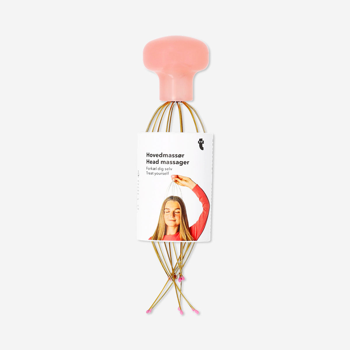 Gold head massager gadget from Flying Tiger Copenhagen with rounded metal prongs for scalp relaxation.