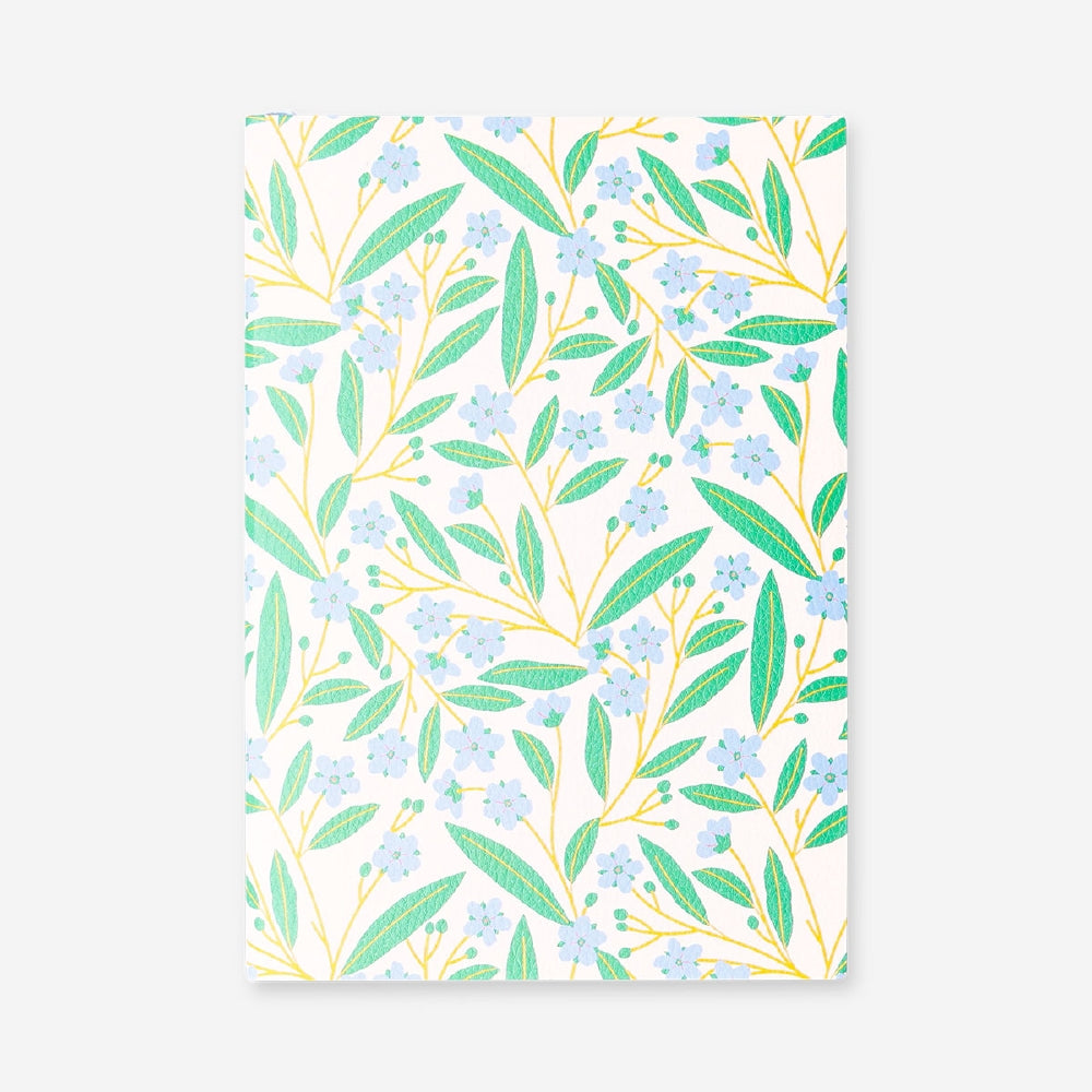 A5 floral bullet planner from Flying Tiger Copenhagen with colorful floral cover and organized pages for note-taking and planning.