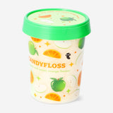 Colorful candy floss in sour apple and sweet orange flavors from Flying Tiger Copenhagen, shown in fluffy, vibrant heaps.