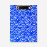 Blue office clipboard with spiral binding and playful cat print, designed by Flying Tiger Copenhagen for organizing notes.