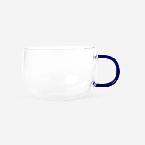 Glass mug with blue handle from Flying Tiger Copenhagen, 350 ml capacity, designed for kitchen use, featuring a sleek and modern look.