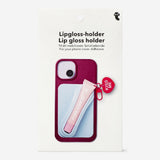 Blue lip gloss holder for phone, media accessory from Flying Tiger Copenhagen with a playful lip design.
