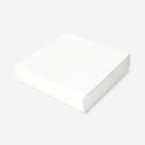 Set of 50 white party napkins from Flying Tiger Copenhagen, neatly folded and stacked for festive occasions.
