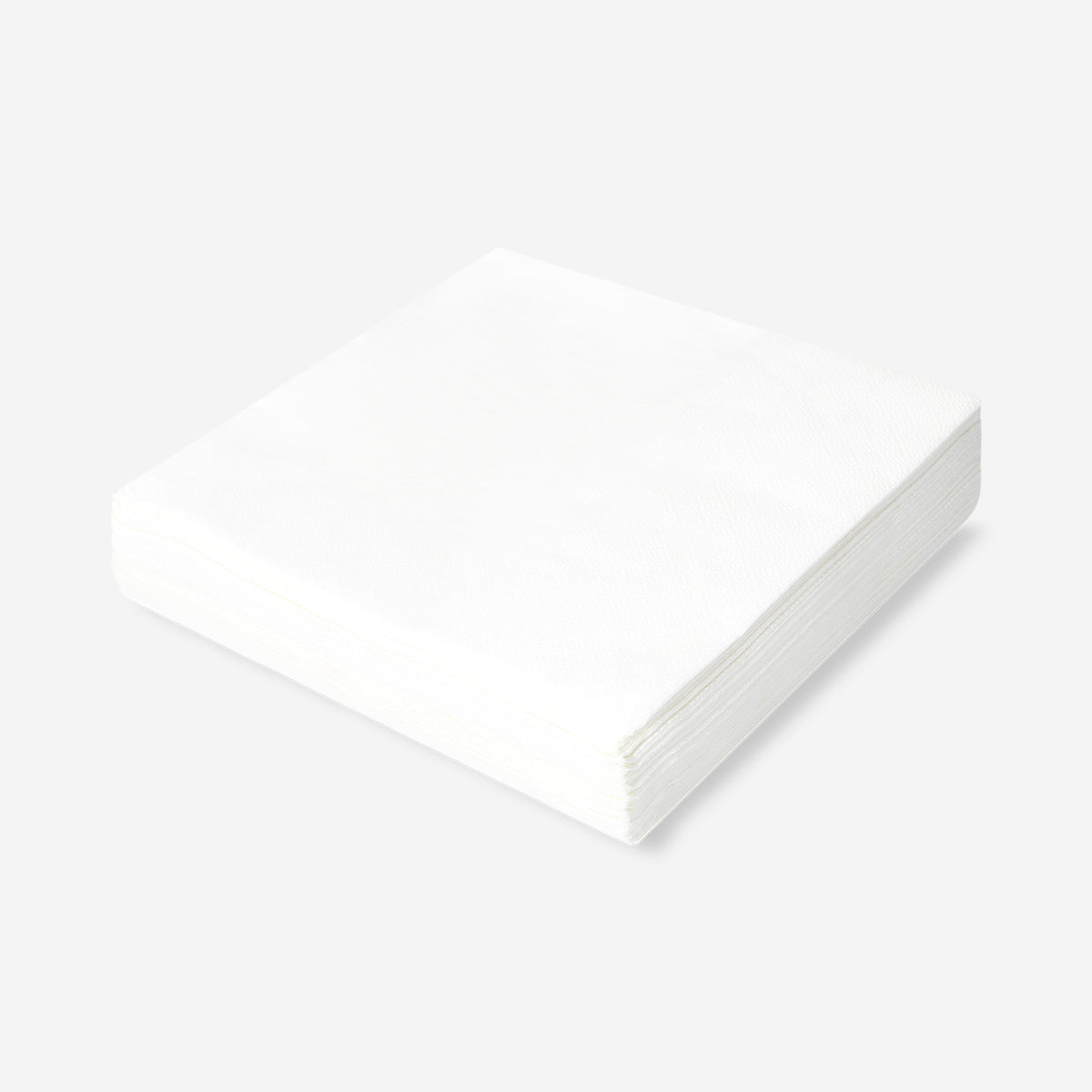 Set of 50 white party napkins from Flying Tiger Copenhagen, neatly folded and stacked for festive occasions.