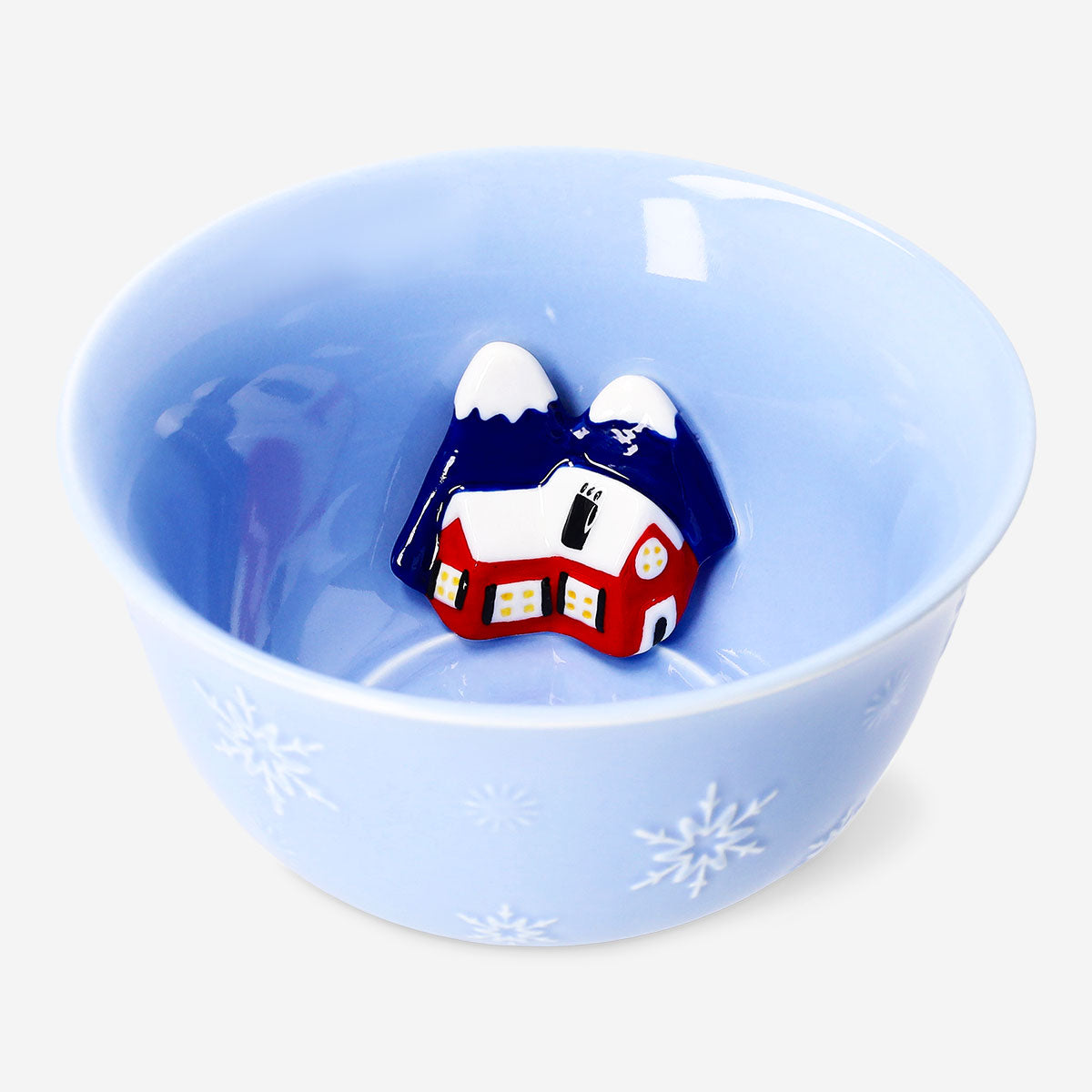 Decorative 14cm ceramic bowl with embossed ski village scene, ideal for kitchen or table use by Flying Tiger Copenhagen.