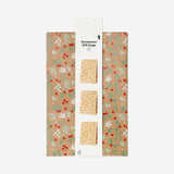 Set of three Flying Tiger Copenhagen paper gift bags with festive holly print, ideal for holiday gift wrapping and office celebrations.