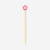 Pink flower topper on a Flying Tiger Copenhagen ballpoint pen, ideal for office use, with a colorful floral design.