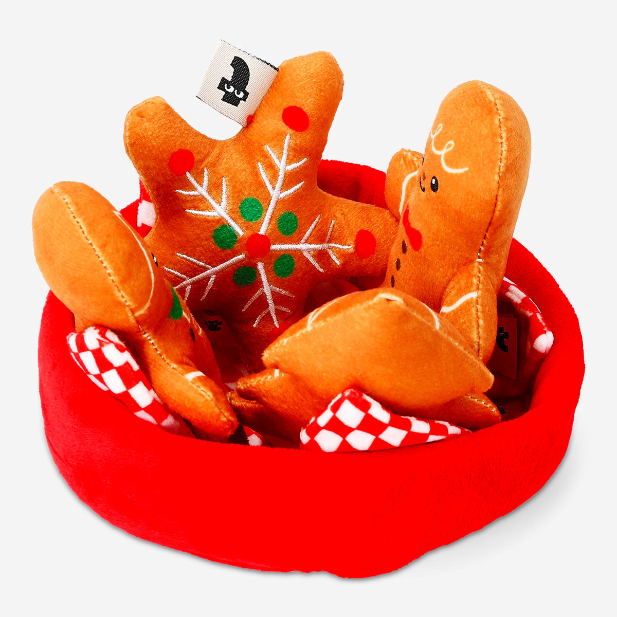 Flying Tiger Copenhagen plush toy basket filled with gingerbread cookie-shaped stuffed toys. Soft, colorful, and playful.
