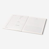 Gradient weekly study planner from Flying Tiger Copenhagen featuring colorful pages and an organized office design.