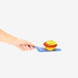 Blue Flying Tiger Copenhagen kitchen cake slicer with text, designed for evenly cutting and serving cakes.