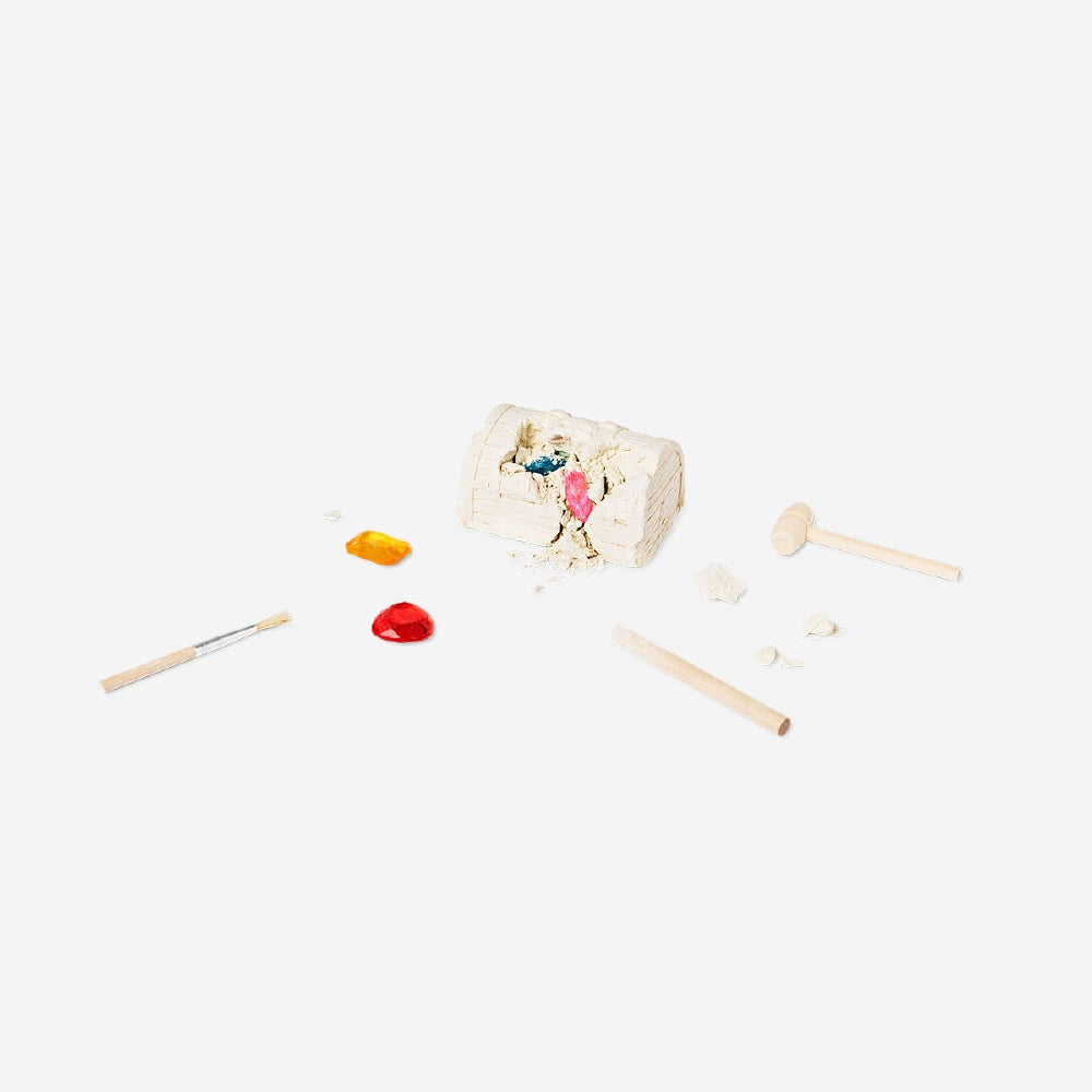 Flying Tiger Copenhagen excavation kit treasure chest toy with small digging tools and hidden surprises inside.