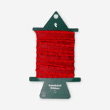 Red frill-edged ribbon, 3 meters long, from Flying Tiger Copenhagen, suitable for office decor or craft projects.