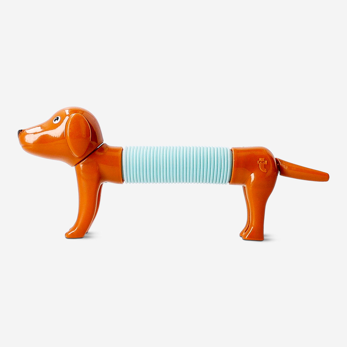Colorful telescopic sausage dog toy from Flying Tiger Copenhagen extended and retracted, showcasing its playful, flexible design.