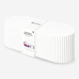 White cable tidy unit for home organization by Flying Tiger Copenhagen, designed to keep cables neat and clutter-free.