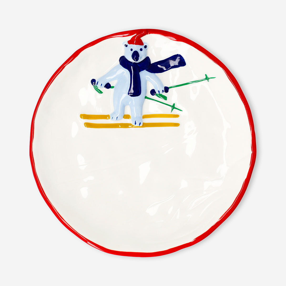 Decorative 21 cm ceramic plate with embossed skiing polar bear design, ideal for kitchen decor by Flying Tiger Copenhagen.