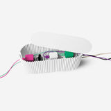White cable tidy unit from Flying Tiger Copenhagen for organizing and managing home electrical cords and cables.