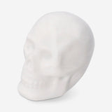 Set of three white skull tealight candles from Flying Tiger Copenhagen, perfect for home decor and ambient lighting.