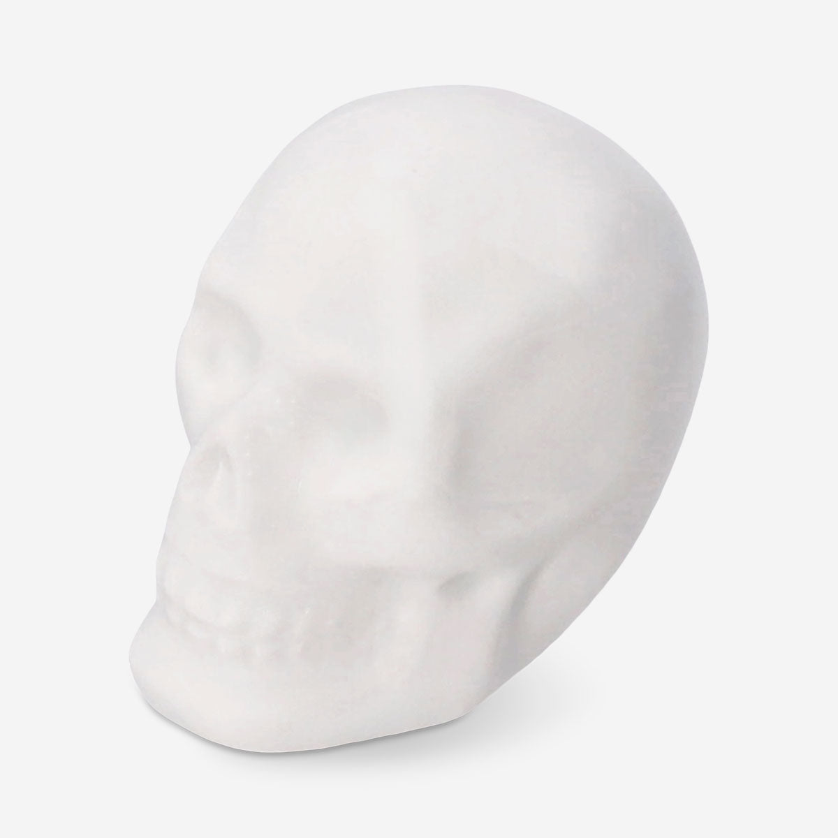 Set of three white skull tealight candles from Flying Tiger Copenhagen, perfect for home decor and ambient lighting.