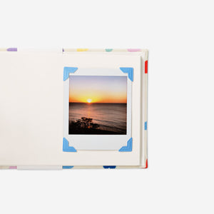 Set of 48 adhesive photo corners for albums, office use, by Flying Tiger Copenhagen, showing clear plastic corners for securing photos.