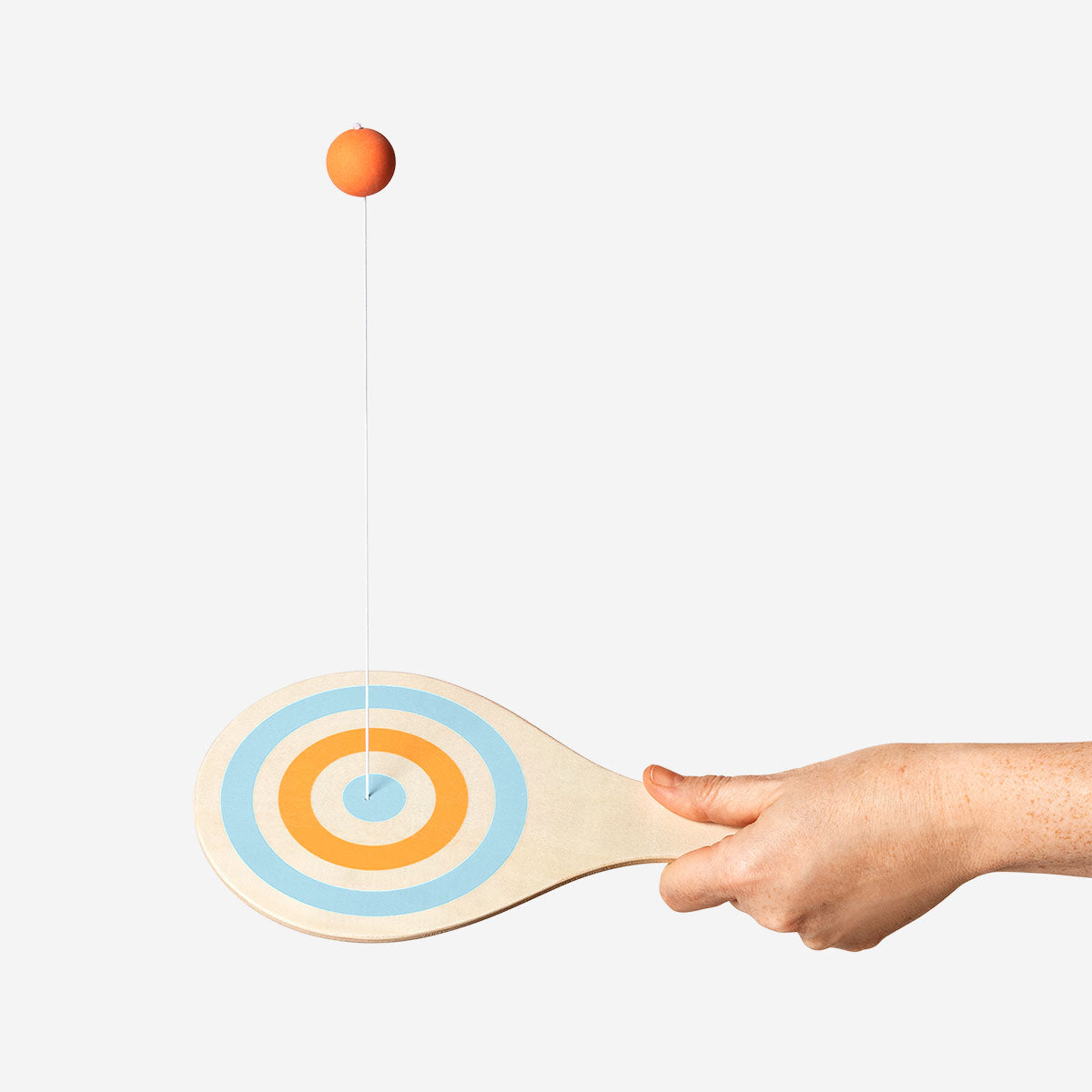 Wooden bat and ball on string game by Flying Tiger Copenhagen, featuring a small wooden bat and ball for indoor play.