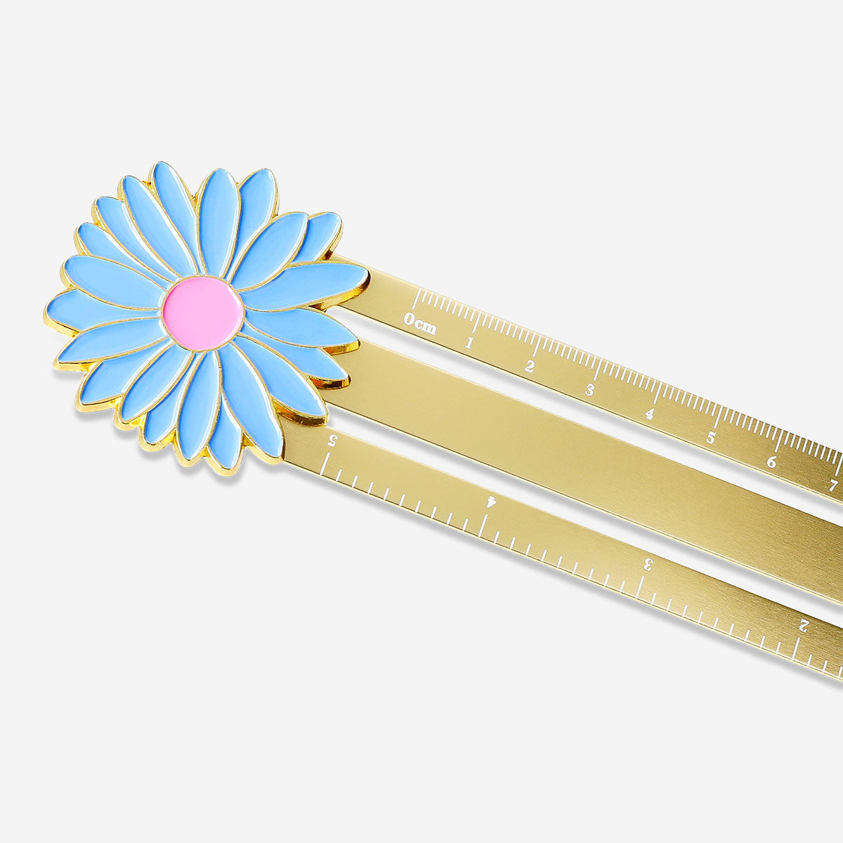 Gold metal office ruler with a decorative flower design, ideal for measuring and adding a touch of style to desk supplies.