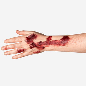 Flying Tiger Copenhagen fake scab kit with sponge for realistic personal care and costume effects, featuring a textured scab and sponge applicator.