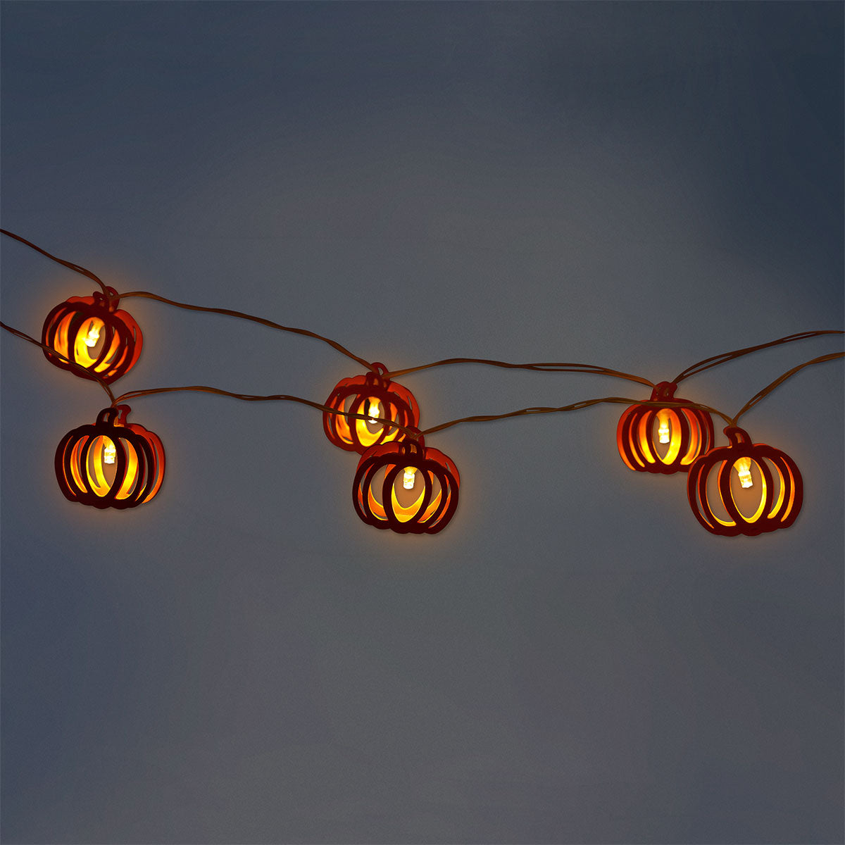 String lights with wooden pumpkin decorations, perfect for home decor, from Flying Tiger Copenhagen.