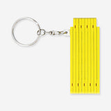 Yellow mini folding ruler key ring from Flying Tiger Copenhagen, a compact gadget with measuring markings and keyring attachment.
