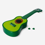 Flying Tiger Copenhagen avocado-shaped ukulele gadget with visible strings and green body, perfect for fun music and novelty collection.