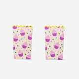 Two paper snack tubs for parties by Flying Tiger Copenhagen, featuring colorful, eco-friendly disposable containers for snacks.