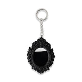 Flying Tiger Copenhagen gothic picture frame keyring made of textile with a dark, gothic design and intricate details.