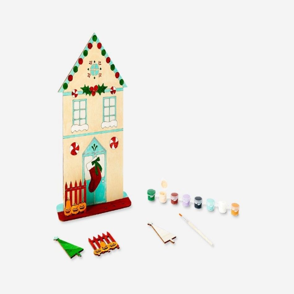 Flying Tiger Copenhagen DIY double-sided wooden house for Halloween and Christmas, featuring festive holiday-themed designs.