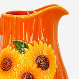 Ceramic kitchen jug with embossed sunflower design, 1.12L capacity, by Flying Tiger Copenhagen, featuring a glossy finish and artistic pattern.