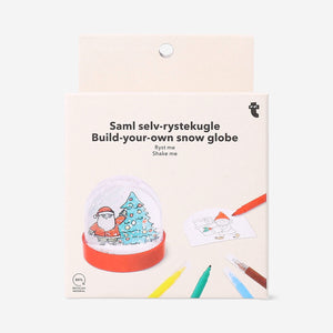 Colorful DIY snowglobe hobby kit with miniature scene and snow particles, by Flying Tiger Copenhagen.