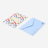 Office birthday card with colorful balloon illustrations by Flying Tiger Copenhagen, featuring cheerful balloon designs for celebrations.