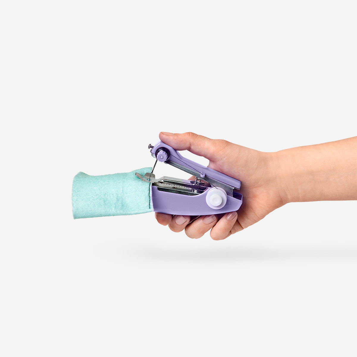 Purple Flying Tiger Copenhagen handheld sewing machine for hobby use, showing the compact, portable device in a close-up shot.