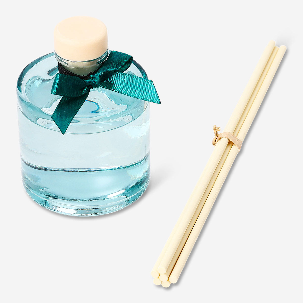 Flying Tiger Copenhagen evergreen reed diffuser for home, featuring a sleek bottle with natural reed sticks and fragrant greenery.