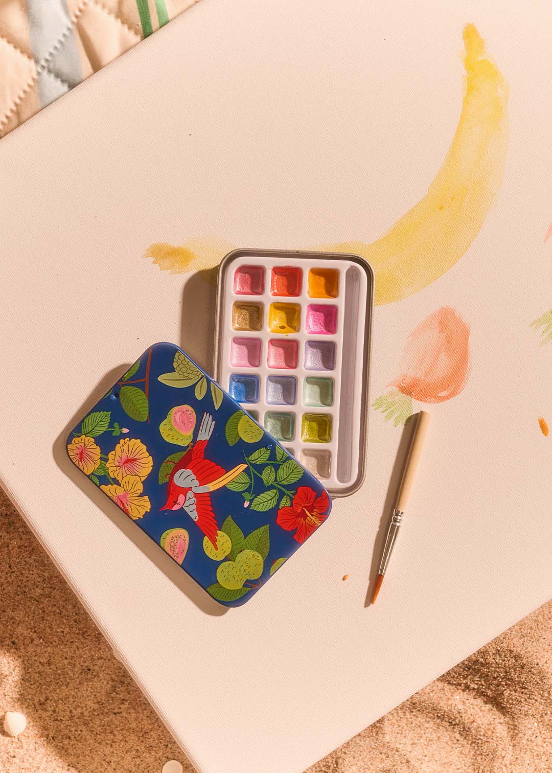 Mini watercolors in tin box for hobby painting by Flying Tiger Copenhagen, featuring vibrant watercolor pans in a compact metal case.
