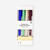 Set of four Flying Tiger Copenhagen whiteboard markers with fine tips for office use, featuring white ink and colorful caps.